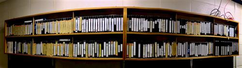 Picture of a wall of old VHS tapes 